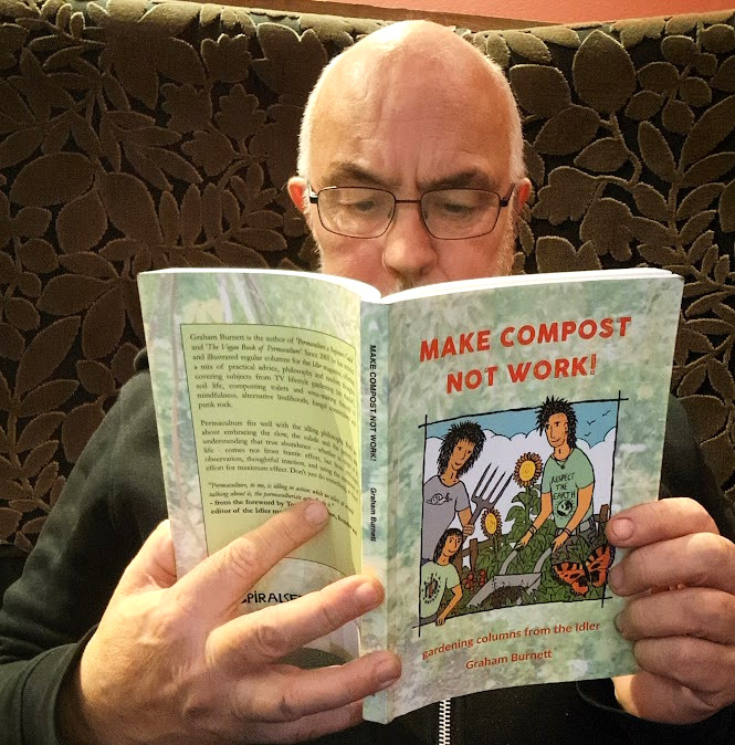 Graham reading a copy of Make Compost, Not Work